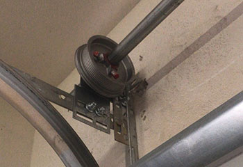 Inside view showing heavy-duty steel garage door tracks and newly installed lifting cables in Dixon, CA home garage
